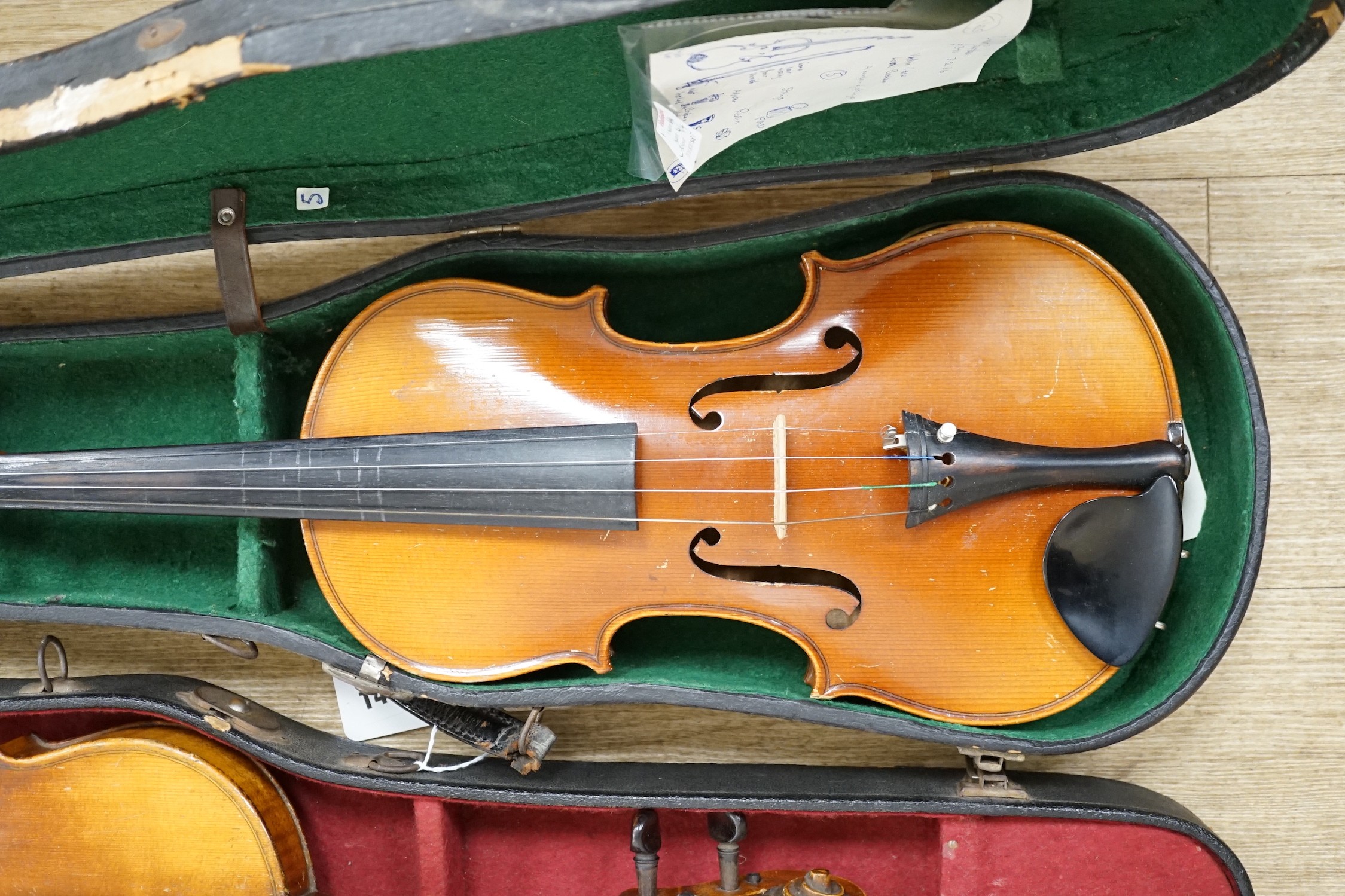 Two cased double back violins
